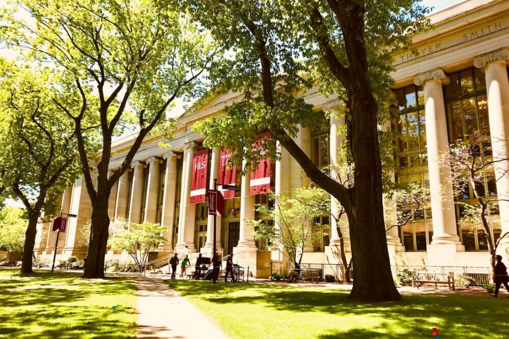 Harvard School of Law building in front of green grass