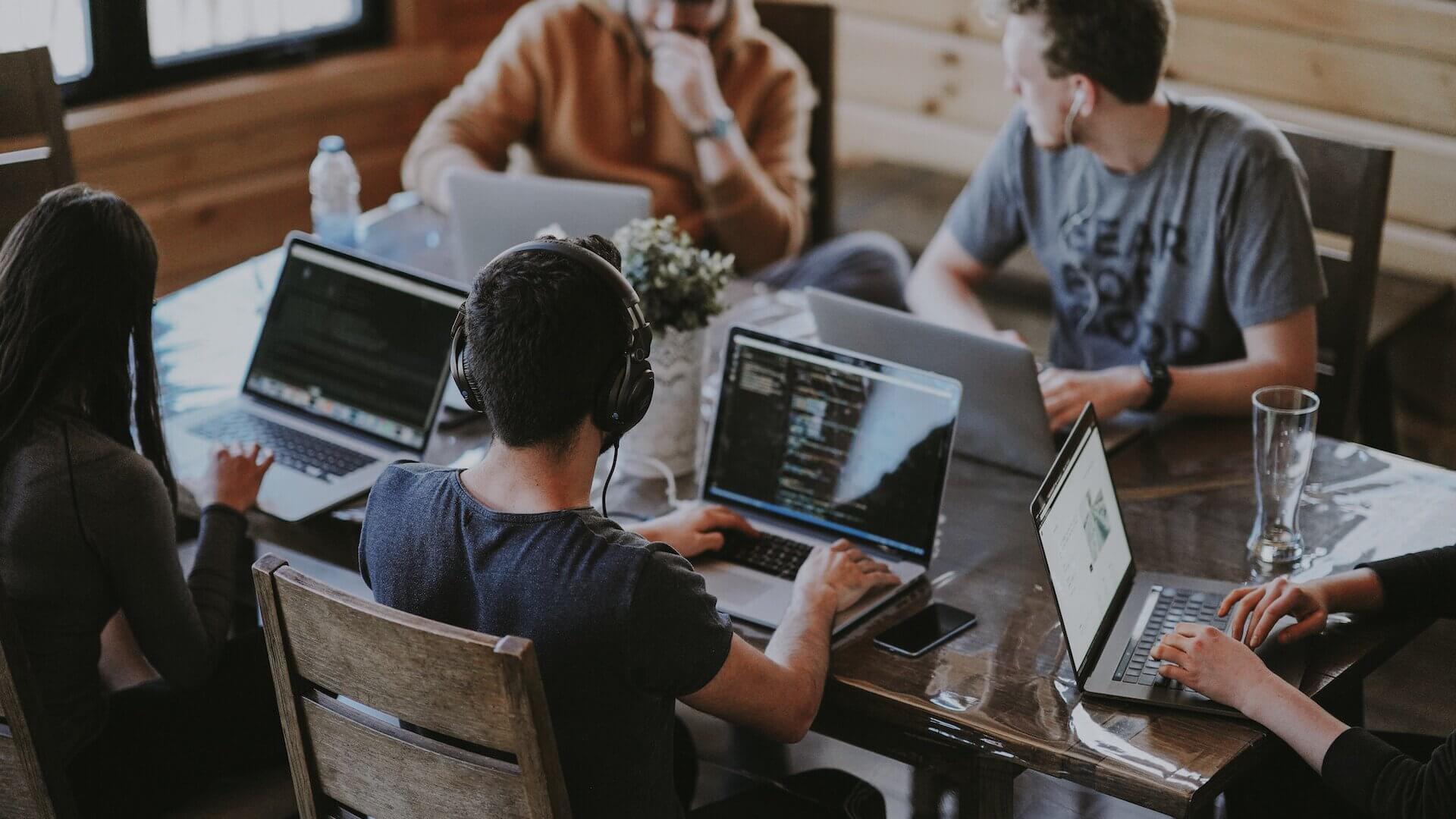 students on computers at table