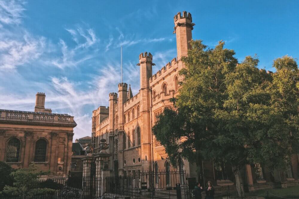 people walking on street near Cambridge University