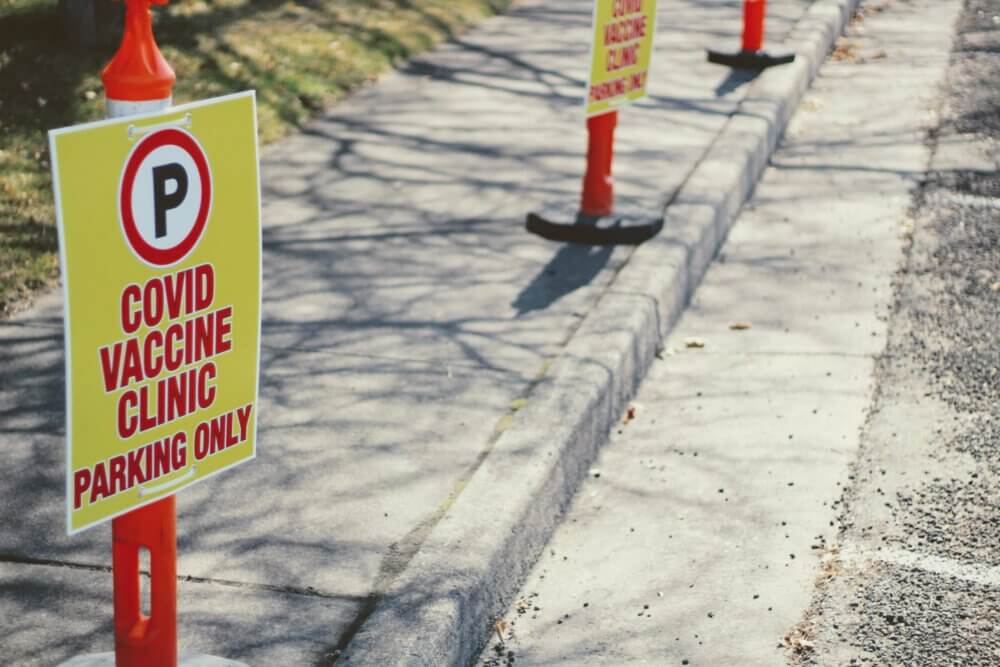 covid vaccine parking sign