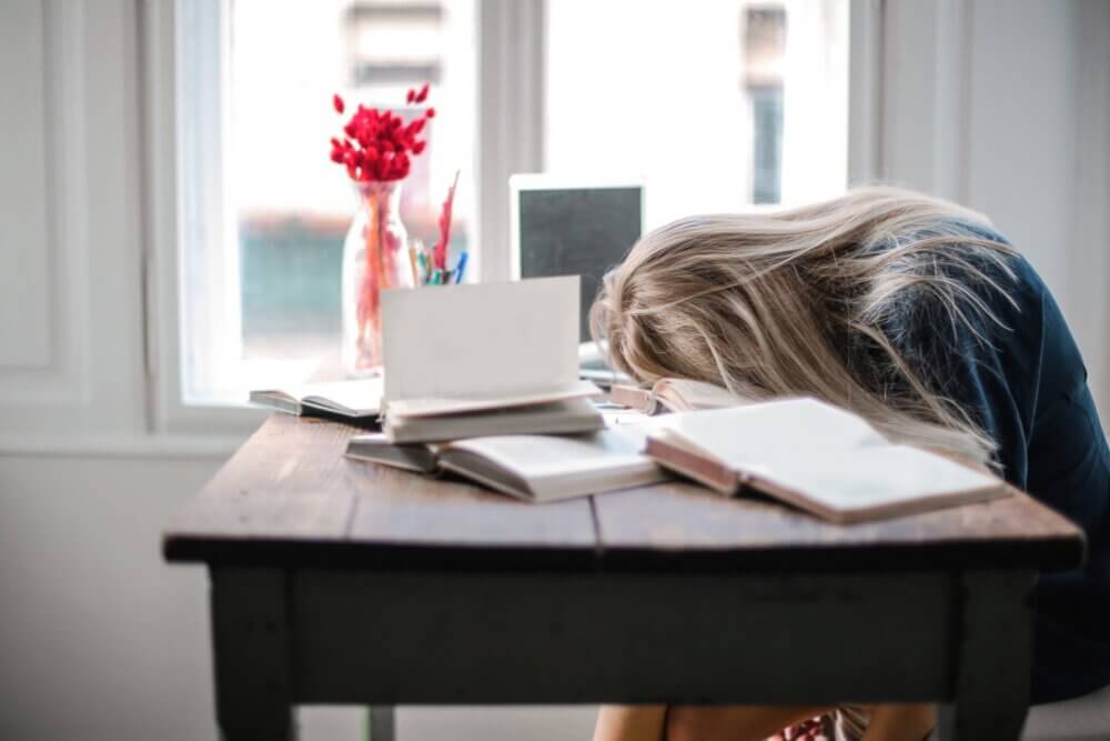 Student with head down on desk