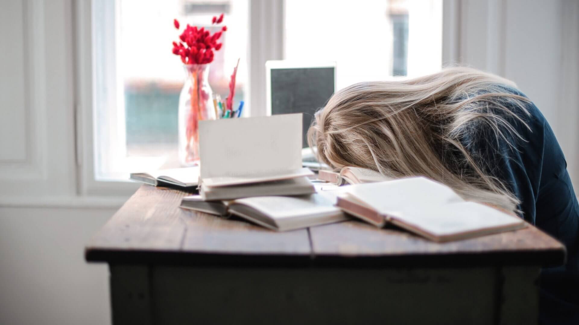 Student with head down on desk