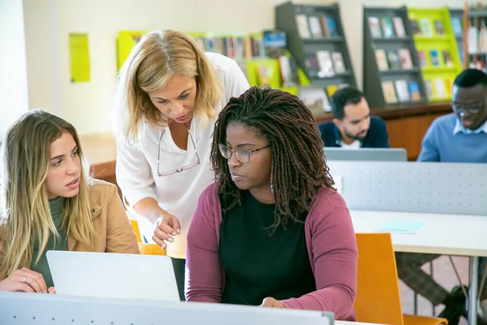 a professor works with two female college students