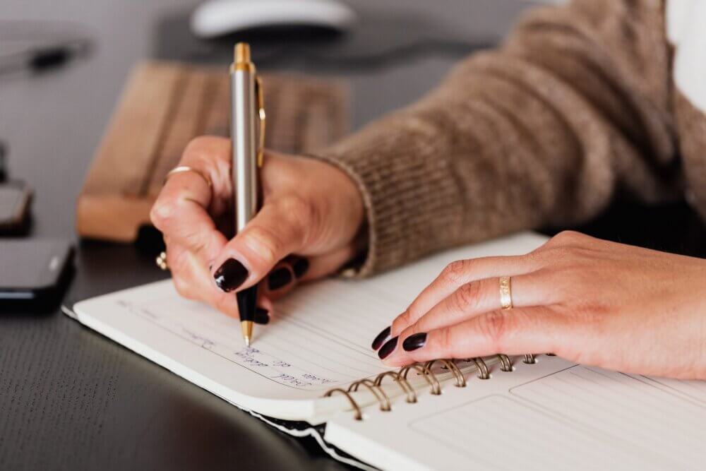 woman taking notes