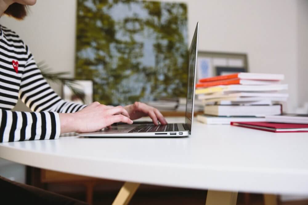 woman typing on computer