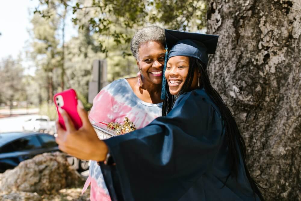 Graduate taking photo with her mother