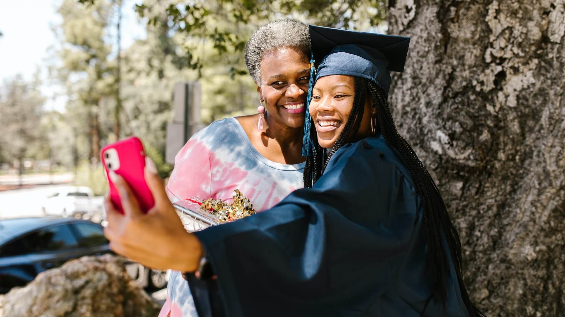 Graduate taking photo with her mother