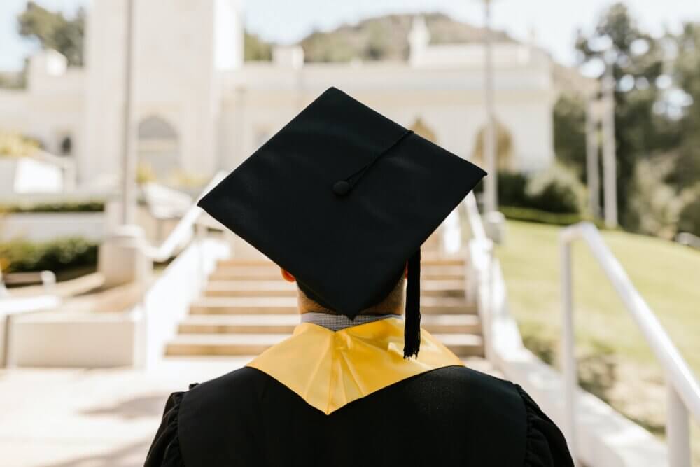 college graduate in cap and gown