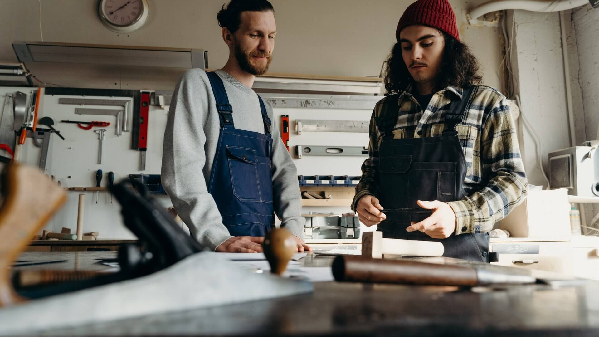 Two men working together in a workshop