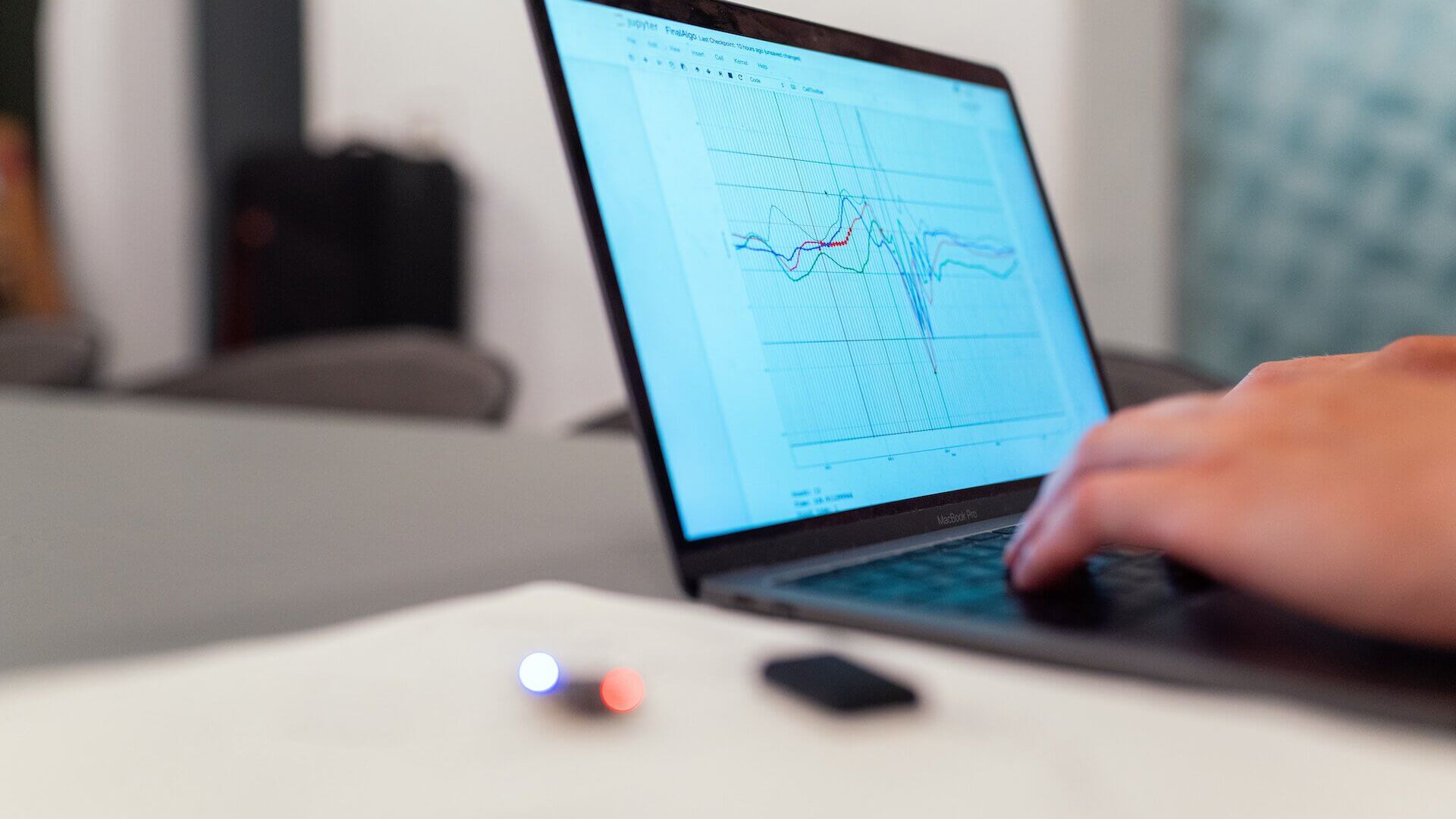 person typing into laptop