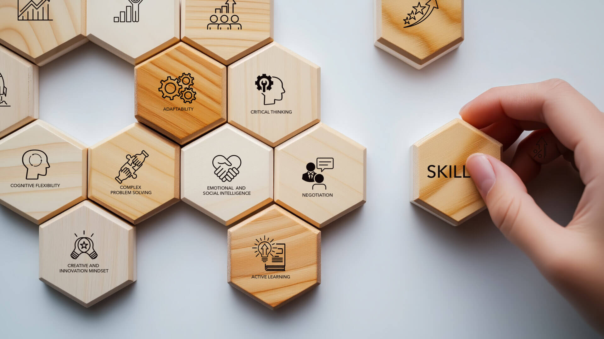 Key future skills represented on wooden hexagonal blocks, including adaptability, critical thinking, and emotional and social intelligence.