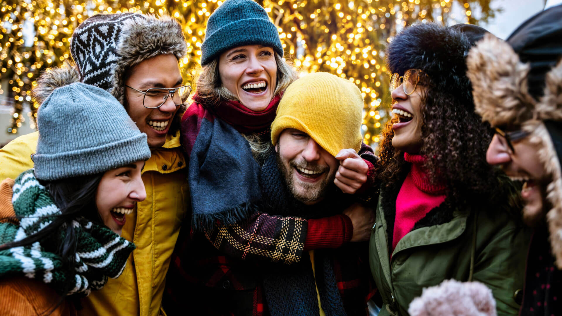 Friends embracing at christmastime.